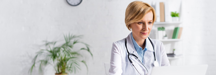 Chiropractic Southeast FL Doctor At Desk